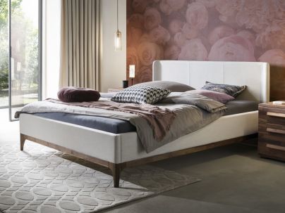 HASENA - Lit capitonné avec pieds de lit en noyer massif