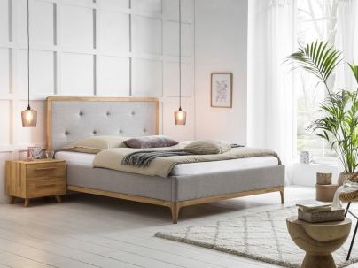 Lit Silento pieds et encadrement de la tête de lit en chêne massif : Hasena fabricant Suisse. Le Monde du Lit